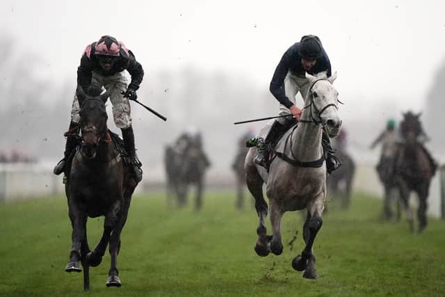 Snow Leopardess ridden by Aidan Coleman (right) runs home to win the Unibet Becher Handicap Chase from Hill Sixteen and Craig Nichol (left).
