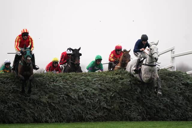 Snow Leopardess ridden by Aidan Coleman (right) clears The Chair before going on to win the Unibet Becher Handicap Chase at Aintree. On the left is Top Ville Ben and Tommy Dowson for Catterick trainer Phil Kirby.