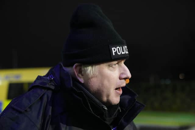 Prime Minister Boris Johnson observes an early morning Merseyside Police raid on a home in Liverpool as part of 'Operation Toxic' to infiltrate County Lines drug dealings, ahead of the publication of the government's 10-year drug strategy.