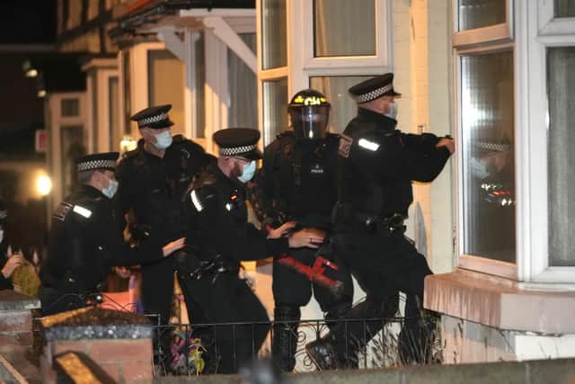 Police make an early morning raid on a home in Liverpool, watched by Prime Minister Boris Johnson, as part of 'Operation Toxic' to infiltrate County Lines drug dealings, before the Government announced £300m for a nationwide crackdown