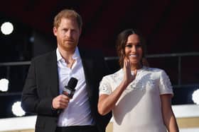 Prince Harry and Meghan Markle speak during the 2021 Global Citizen Live festival at the Great Lawn, Central Park on September 25, 2021 in New York City. Photo by ANGELA WEISS/AFP via Getty Images.