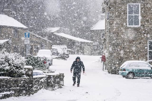 A man walks through the snow in Gunnerside, North Yorkshire. on November 28, 2021 in the aftermath of Storm Arwen which wreaked havoc across much of the UK. Picture: Danny Lawson/PA Wire.