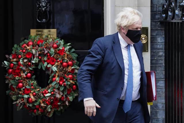 Boris Johnson pictured on Downing Street in December 2021