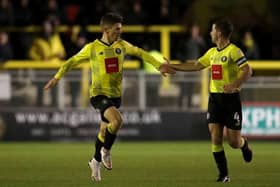 Harrogate Town's Lloyd Kerry (left) celebrates scoring their side's goal with team-mate Josh Falkingham. Pictures: PA.