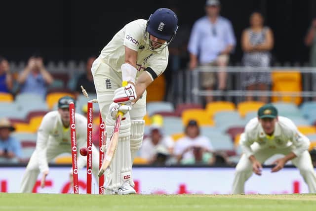 England's Rory Burns is out bowled first ball during day one of the first Ashes cricket test at the Gabba in Brisbane. (AP Photo/Tertius Pickard)
