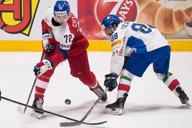 Italy's Tommaso Traversa, right, battles with Czech Republic forward Filip Chytil  during the World Championship Group B clash in Bratislava in May 2019. Picture: Vladimir Simicek/AFP/Getty Images)