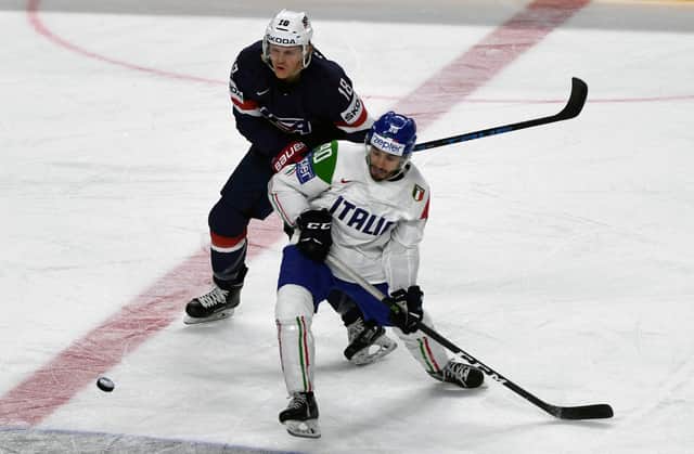 Tommaso Traversa, right, battles with the USA's Christian Dvorak during the World Championship group clash between Italy and the USA in Cologne, May 2017. Picture: PATRIK STOLLARZ/AFP/Getty Images