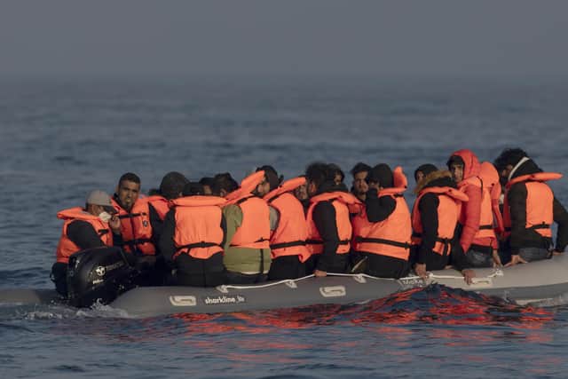 How can the Channel migrants crisis be resolved?
