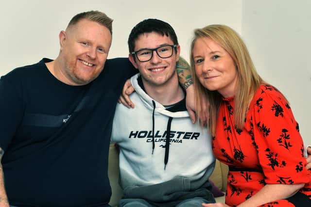Jake with his mum Katie Woolhouse and stepdad Chris Woolhouse who will be running the London marathon for Sheffield Children's Hospital
