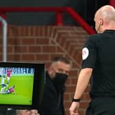 Referee Anthony Taylor consults VAR after a tackle during the Premier League match at Old Trafford. Picture: PA