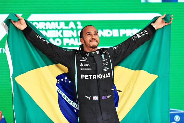 Race winner Lewis Hamilton of Great Britain and Mercedes GP celebrates on the podium during the F1 Grand Prix of Brazil at Autodromo Jose Carlos Pace on November 14, 2021 in Sao Paulo, Brazil. (Picture: Buda Mendes/Getty Images)