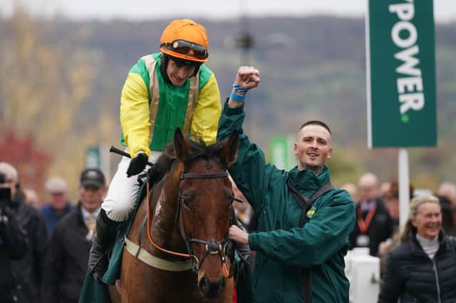 Midnight Shadow and Ryan Mania return to the Cheltenham winners' enclosure with Reece Jarosiewicz (right) and Sue Smith (far right) after their Paddy Power Gold Cup win.