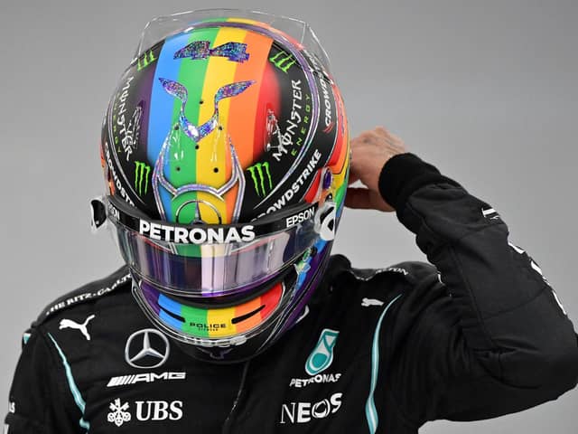 SUPPORT: Lewis Hamilton with his rainbow helmet. Picture: Getty Images.