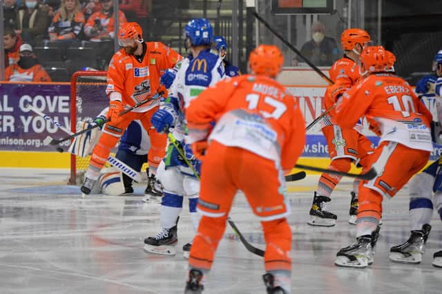 NICE TOUCH: John Armstrong, left, tips in from Evan Mosey to make it 2-0 to Sheffield Steelers against Coventry in Saturday's 3-1 win. Picture: Dean Woolley/EIHL.