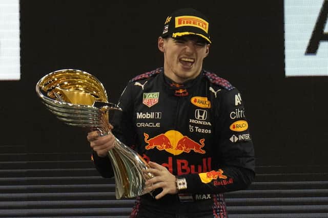 Just champion: Red Bull driver Max Verstappen celebrates after he became the Formula 1 world champion in Abu Dhabi. (AP Photo/Hassan Ammar)