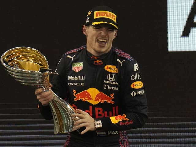 Just champion: Red Bull driver Max Verstappen celebrates after he became the Formula 1 world champion in Abu Dhabi. (AP Photo/Hassan Ammar)
