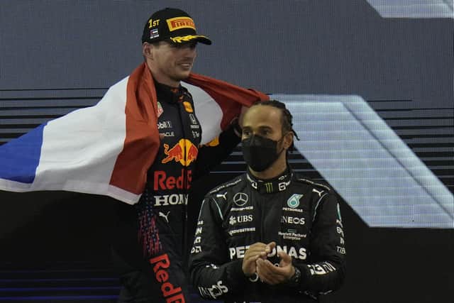 Victor and vanquished: Red Bull driver Max Verstappen and Mercedes' Lewis Hamilton. (AP Photo/Hassan Ammar)