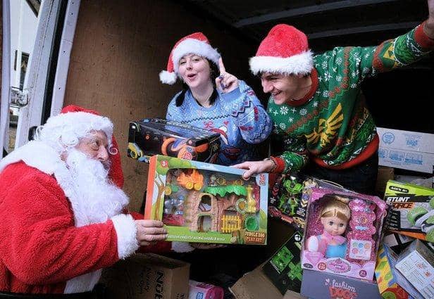 Joe and Courtney Maw delivering some of the toys they collected to the Rainbow Centre