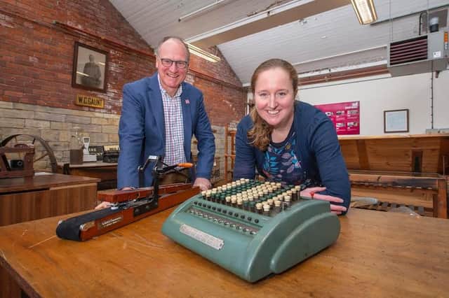 William Gaunt and Rachel Moaby with a comptometer, which was the first mechanical calculator used in the mill office
