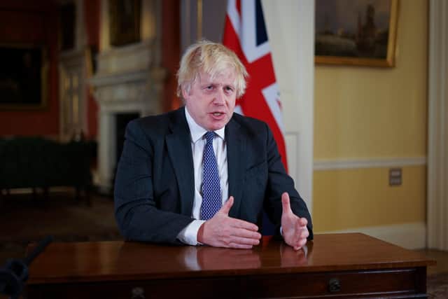 Prime Minister Boris Johnson, gestures as he records an address to the nation at Downing Street, London, to provide an update on the booster vaccine programme.