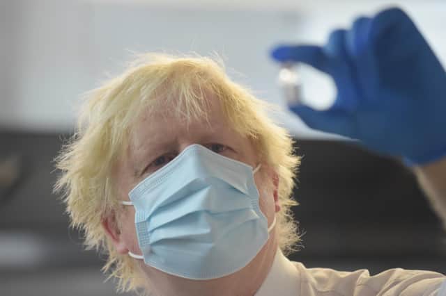 Prime Minister Boris Johnson during a visit to the Stow Health Vaccination centre in Westminster, central London.