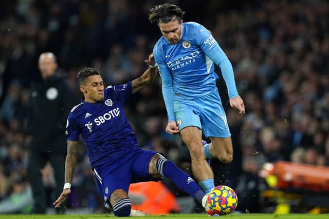 Leeds United's Raphinha (left) challenges Manchester City's Jack Grealish. Picture: PA.