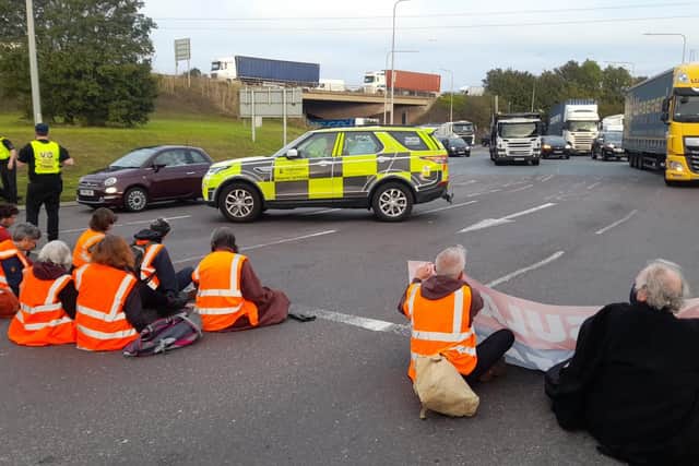 Handout photo issued by Insulate Britain of protesters from Insulate Britain blocking the M25 at junction 31, near to the Dartford Crossing in Thurrock, Essex