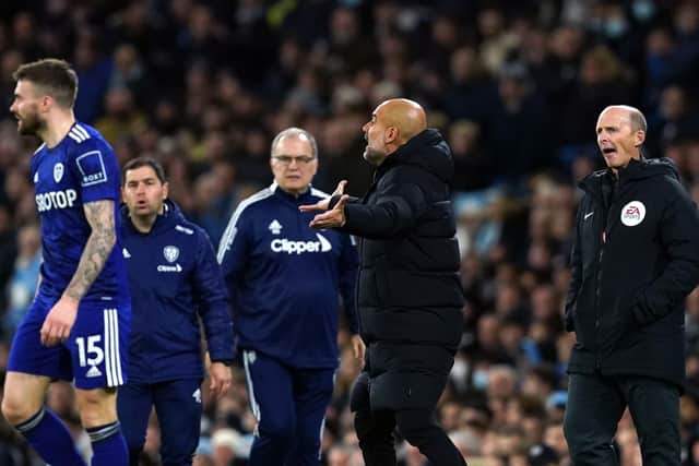 Manchester City manager Pep Guardiola (centre right) appeals to an official during the Premier League clash with Leeds United at the Eithad Stadium as Whites head coach Marcelo Bielsa watches on. Picture: Martin Rickett/PA