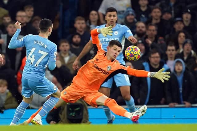 Manchester City's Phil Foden (left) scores their side's first goal of the game past Leeds goalkeeper Ilan Meslier during Tuesday night's Premier League match at the Eithad Stadium. Picture: Martin Rickett/PA