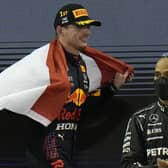 Contrasting emotions: Lewis Hamilton, right, and Max Verstappen, after Sunday’s dramatic F1 finale. (Picture: AP/Hassan Ammar)