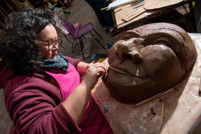 Sandra McCracken working on a mould for a puppet's face.