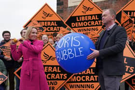 New North Shropshire MP Helen Morgan bursts a balloon called 'Boris' Bubble' to celebrate the shock Liberal Democrat win.