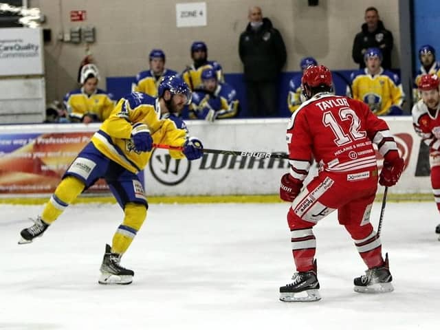 INCOMING: Leeds Knights' Adam Barnes, left, gets in a shot on Swindon Wildcats' net in the second period. Picture courtesy of David North/Swindon Wildcats.