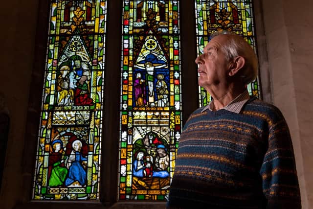 The head of the steering committee for the windows project at All Saints North Street in York, David Titchener, in front of The latest window to be completed and returned, The Lady Chapel east window. Picture Bruce Rollinson