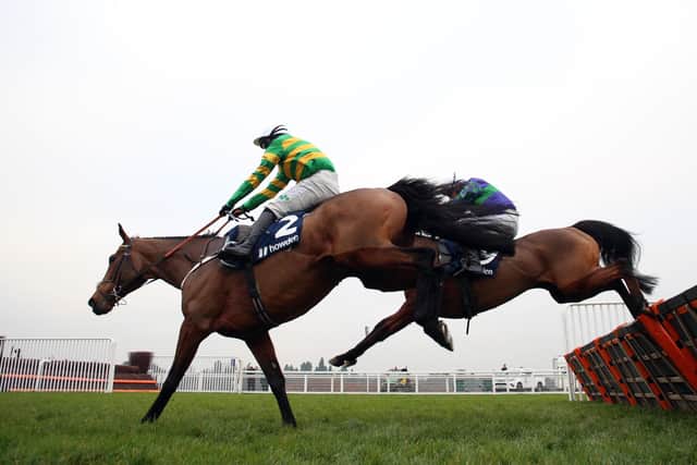 Champ ridden by Jonjo O'Neill Jr. on their way to winning the Howden Long Walk Hurdle during day two of the Howden Christmas Racing Weekend at Ascot Racecourse, Berkshire.
