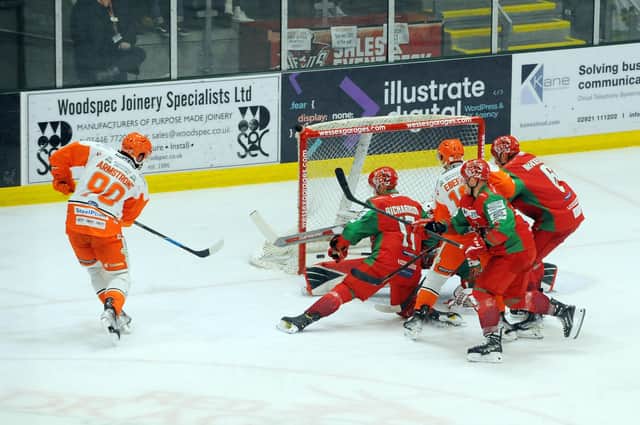 GETTING AHEAD: John Armstrong, left, puts Sheffield Steelers 3-2 ahead in their Elite League clash with Cardiff Devils. Picture: Dave Williams/EIHL.
