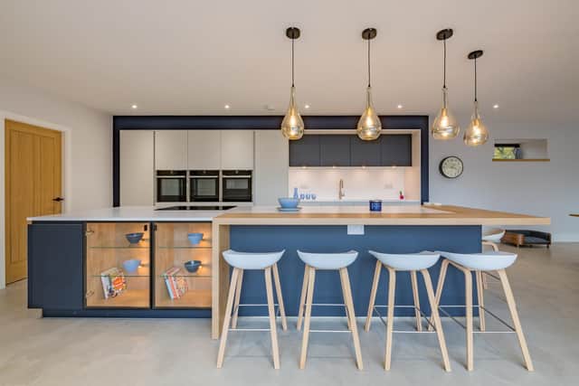 The stylish kithcen from Leeds-based Kreativ Kitchens with pendant lights from Ocean Lighting