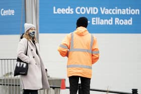 A woman arrives at the Elland Road Leeds COVID Vaccination Centre (PA)