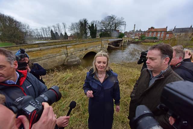 Liz Truss during a visit to Tadcaster in December 2015 when floods led to the collapse of the town's bridge over the river Wharfe.