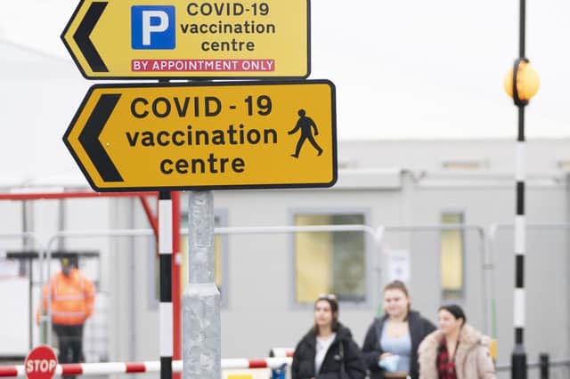 People arrive at the Elland Road Leeds COVID Vaccination Centre