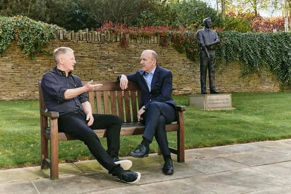 David Potts (left) chats to Morrisons' chairman Terry Leahy (right) in front of the statue of Sir Ken Morrison at Morrisons HQ