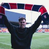 NEW ARRIVAL: Jack Mackay in standard new-signing pose at York's Community Stadium