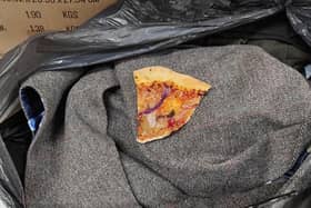 A slice of pizza was sequestered away inside a man's coat.