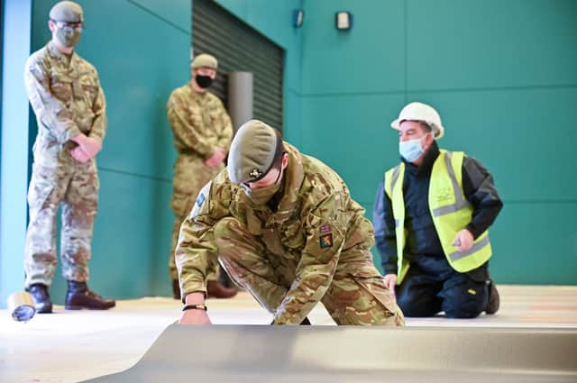 Soldiers building a Covid vaccine centre last year - but should they be more deployed more frequently by Ministers?