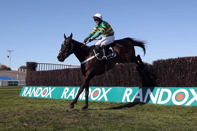 Chantry House ridden by jockey Nico de Boinville clear a fence on their way to winning the Betway Mildmay Novices' Chase during Ladies Day of the 2021 Randox Health Grand National Festival at Aintree.