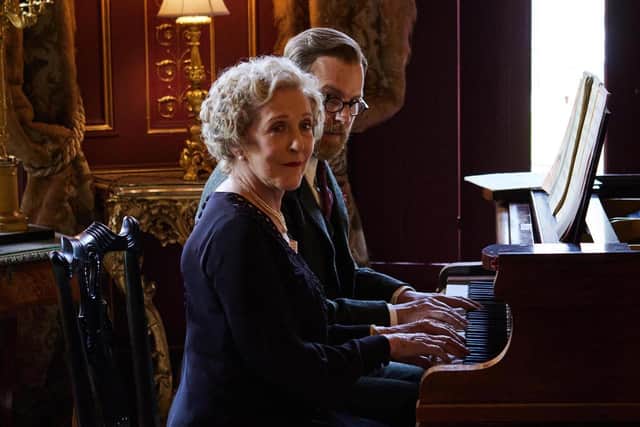 Mrs Pumphrey (Patricia Hodge) and Siegfried (Samuel West) at the piano.
