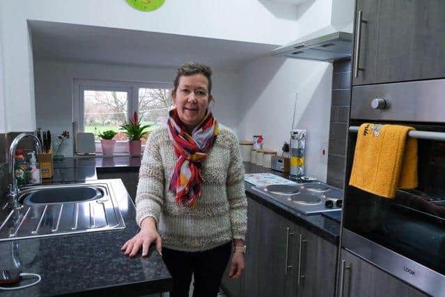 Joy Needham, 57, in her kitchen in Sheffield that was rebuilt after a massive fire destroyed it earlier this year, thanks to help and support from the community.