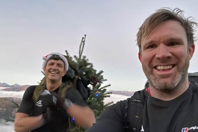 Mr Jackson, a quadriplegic former rugby union star and fellow climber Mr Stirling, are carrying a Christmas tree up the UK's highest mountains to raise money for charity.