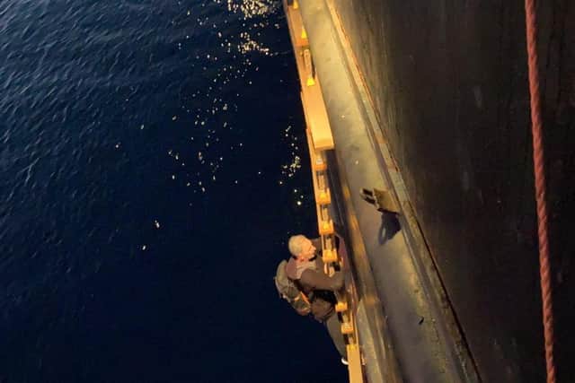 Rescue - Chris Pearsall, climbing aboard the rescue ship. Image supplied.