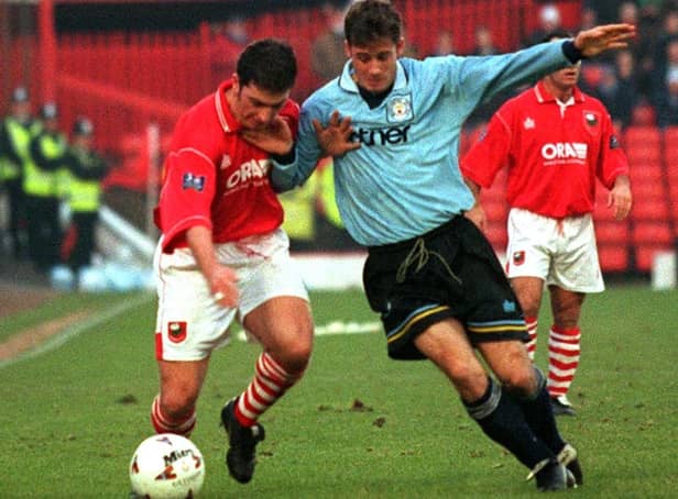 Oakwell hero: Barnsley's Nicky Eaden gets to grips with Manchester's Neil Heaney.
